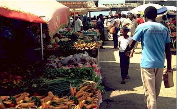 stalls; hustle; bustle; shadows; vegetables; shouting; buying; carrying; bargains