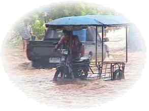 A rickshaw in a monsoon shower
